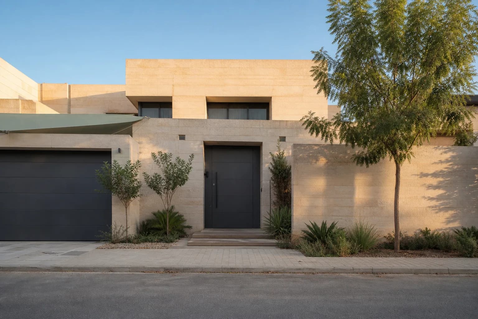 Ahmed's beige-stone villa with its gray entrance door